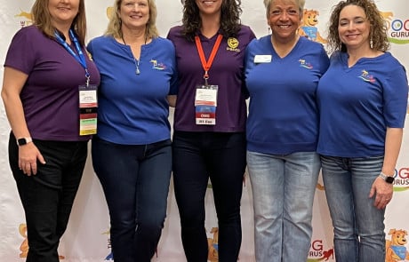 Jenn Dahinten with fellow PACCC Board Chairs at The Dog Gurus Conference 2024, promoting professional standards and certification in the pet care industry.