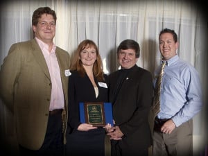 Jenn Dahinten and the Royal Pets Hotel team receiving the Oro-Medonte Chamber of Commerce Award for Outstanding Business Achievement from the local Ontario Member of Parliament.